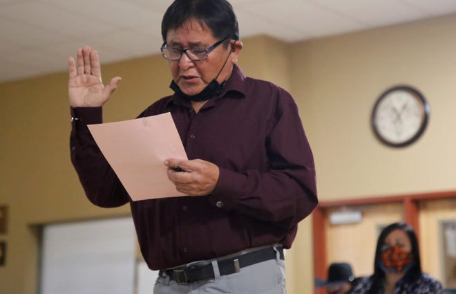 Albert Lee takes the oath of office for the Upper Fruitland Chapter farm board member on Jan. 6 during the Navajo Nation chapter government inauguration. The elected officials participated in the event at the chapter house in Upper Fruitland.