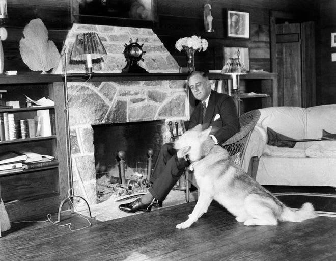 Franklin D. Roosevelt with pet dog, Major, a German shepherd, shown in this undated photo at the president's home at Warm Springs, Ga., known as the Little White House. Roosevelt had a total of six dogs during his time at the White House.