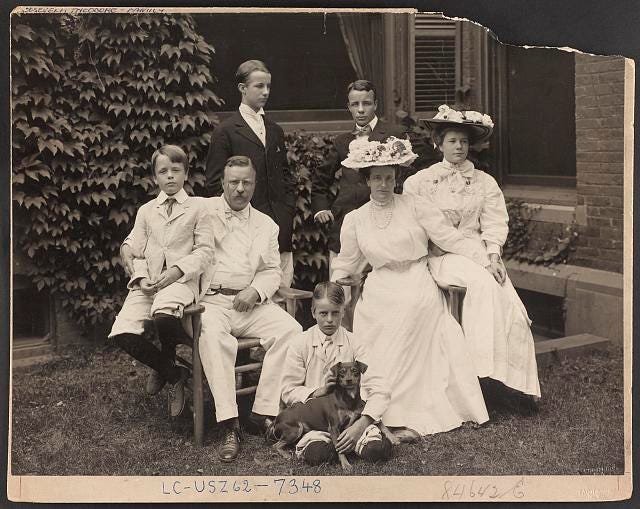President Theodore Roosevelt and family have their photo taken with their dog 'Skip.'