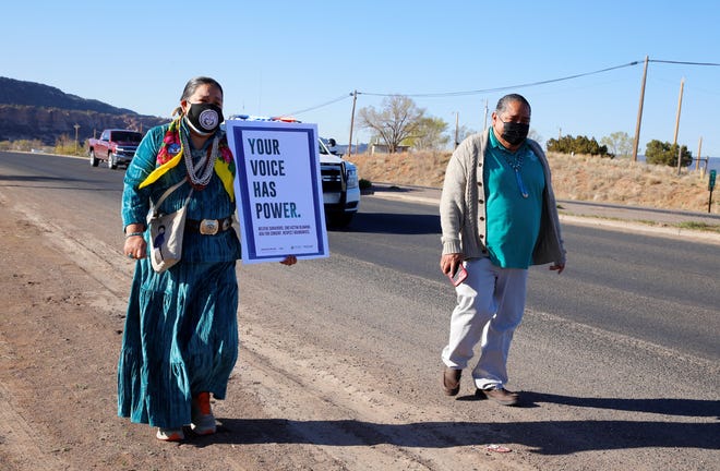 Delegate Amber Kanazbah Crotty and Tommy Tsosie, legislative staff assistant with the Office of the Speaker, walk on April 19 in Window Rock, Arizona to raise awareness about sexual assault on the Navajo Nation.